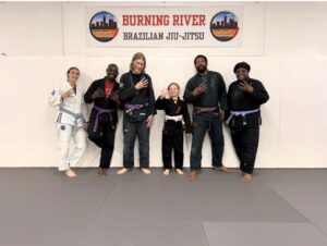 Kennedy getting her 4th stripe on her white belt in Brazilian Jiu-Jitsu
